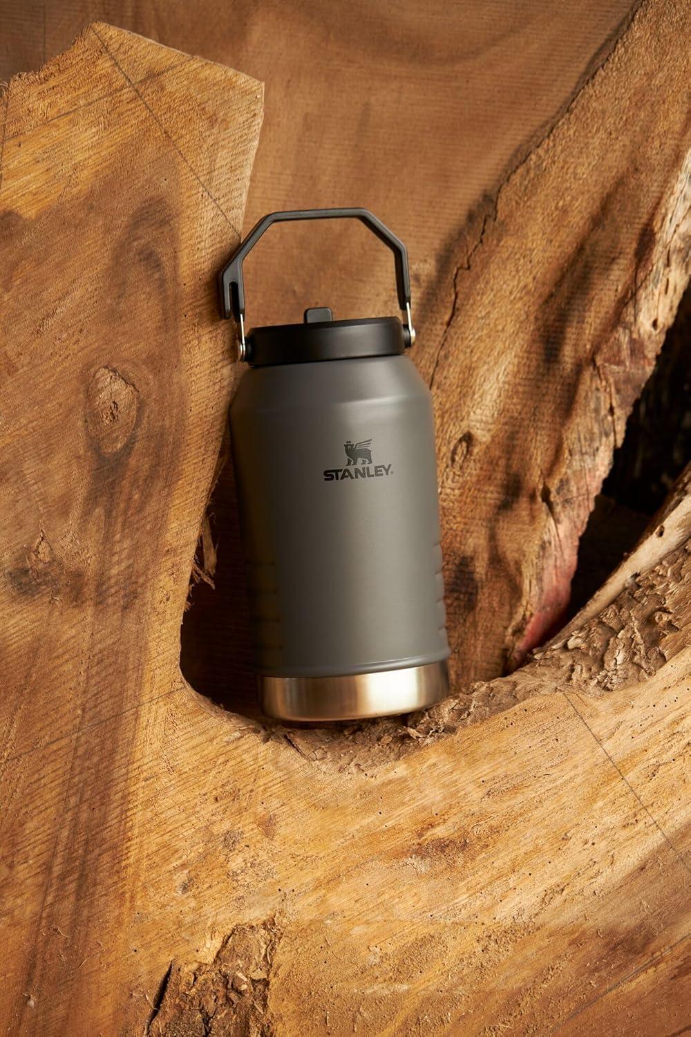 imageSTANLEY IceFlow 20 Flip Straw Jug with Handle 40 oz Twist On Lid and Flip Up Straw Leakproof for Travel and Sports Insulated Stainless Steel BPAFree Black 20Charcoal