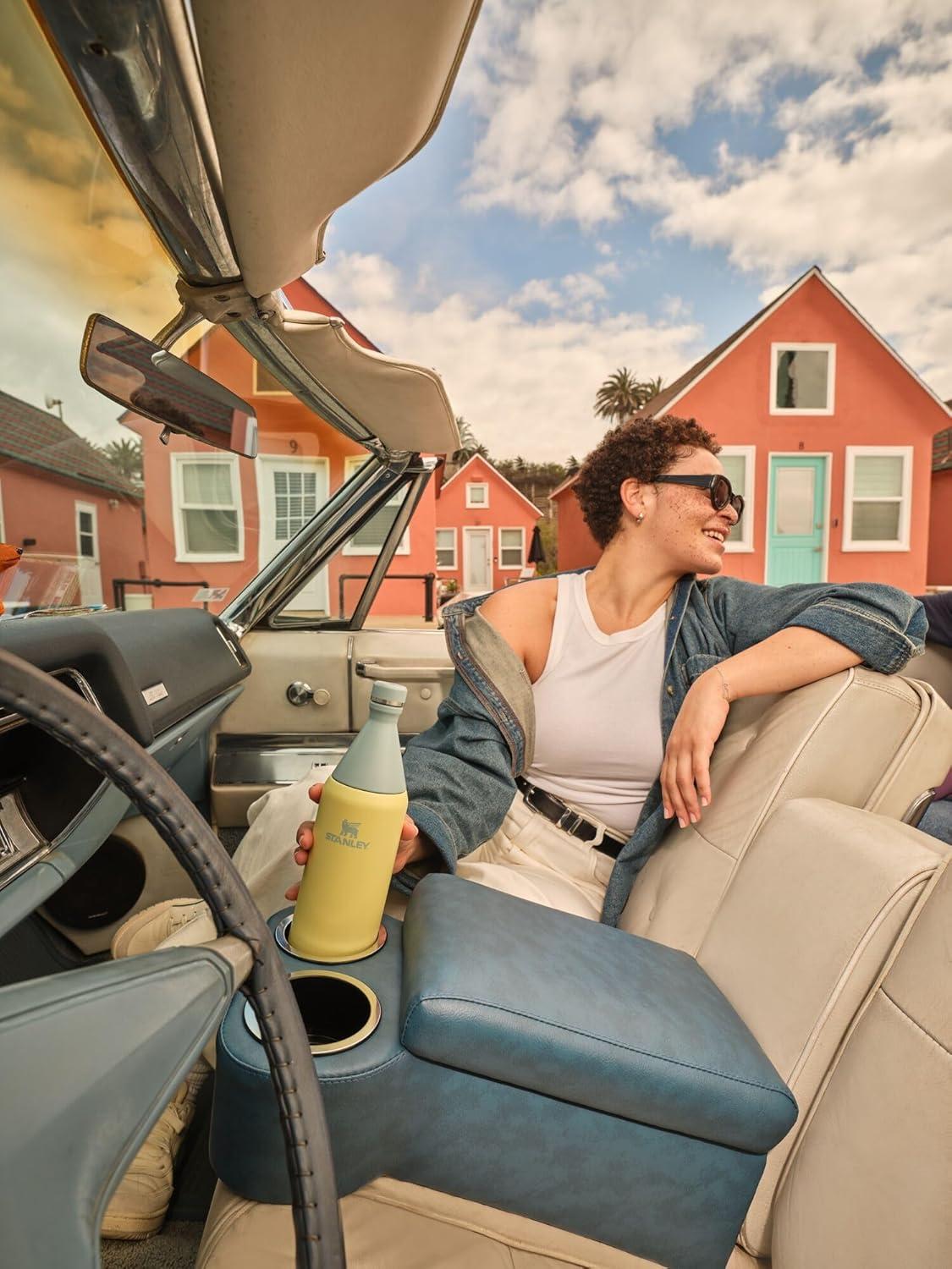 imageStanley All Day Slim Bottle 34 oz Twist off Lid with Leakproof Seal Slim Design for Travel and Gym Insulated Stainless Steel Water Bottle BPAFree Garnet Shine