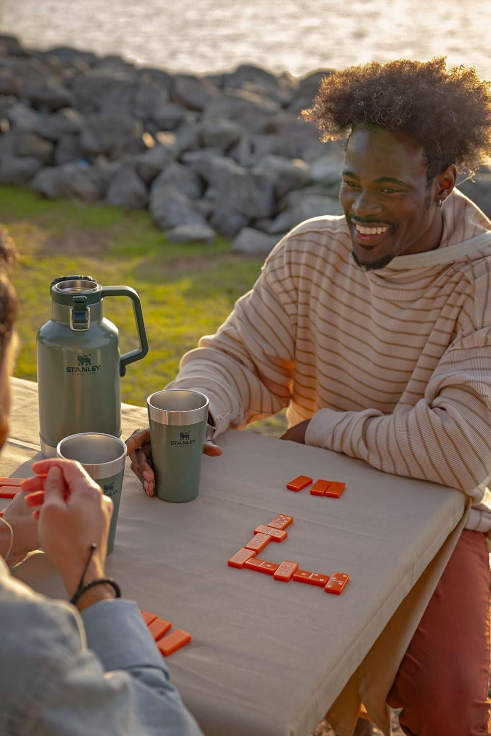 imageStanley Classic EasyPour Growler 64 oz Keeps Beer Cold or Coffee Hot Leakproof Steel Lined Lid and Easy to Carry Handle Insulated Stainless Steel BPAFree Black 20Green