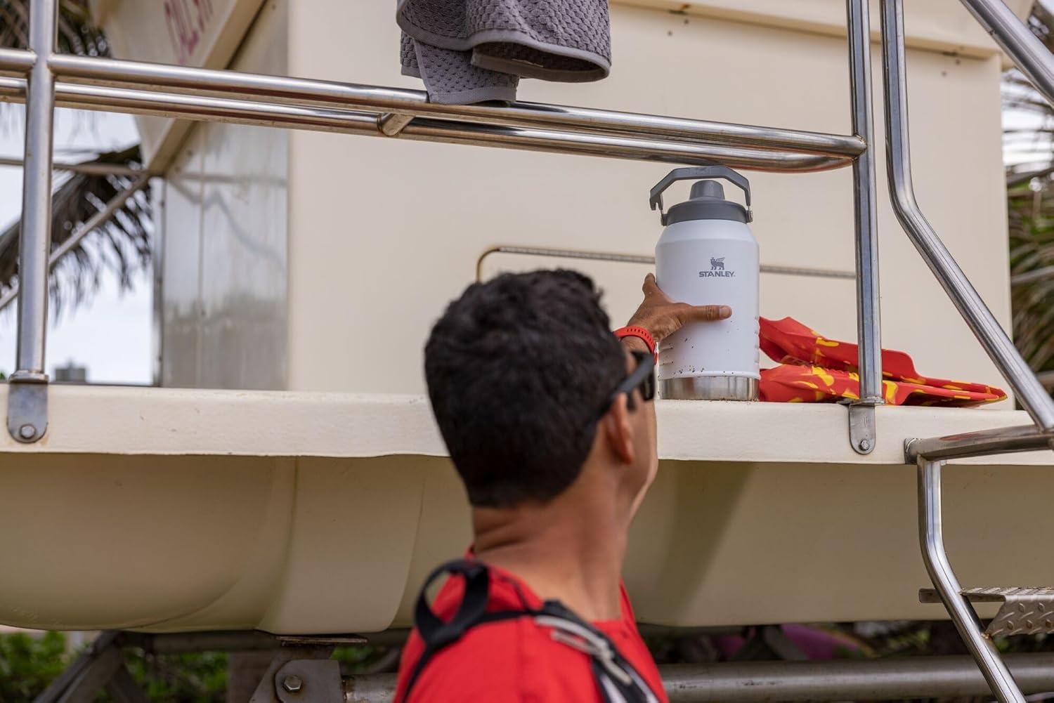 imageStanley IceFlow Fast Flow Jug with Handle 64 oz Twist On Angled Spout Lid Leakproof for Travel and Sports Insulated Stainless Steel BPAFree BlackPolar