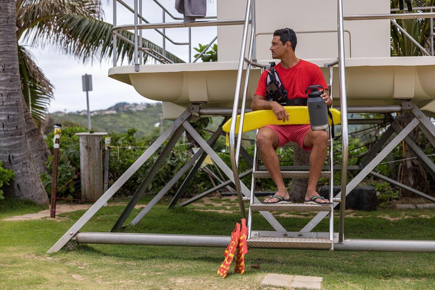 imageStanley IceFlow Fast Flow Jug with Handle 64 oz Twist On Angled Spout Lid Leakproof for Travel and Sports Insulated Stainless Steel BPAFree BlackCharcoal