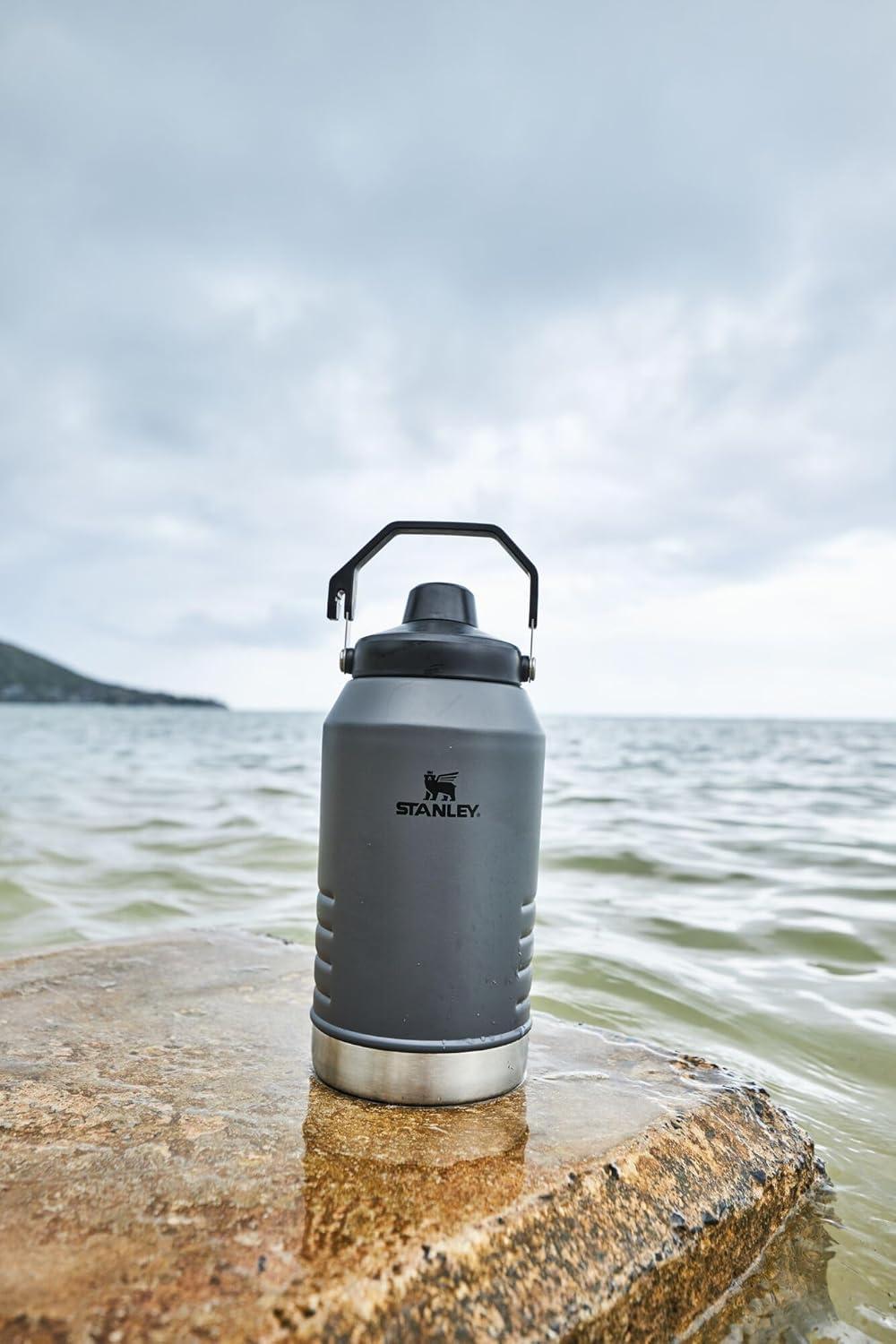 imageStanley IceFlow Fast Flow Jug with Handle 64 oz Twist On Angled Spout Lid Leakproof for Travel and Sports Insulated Stainless Steel BPAFree BlackCharcoal