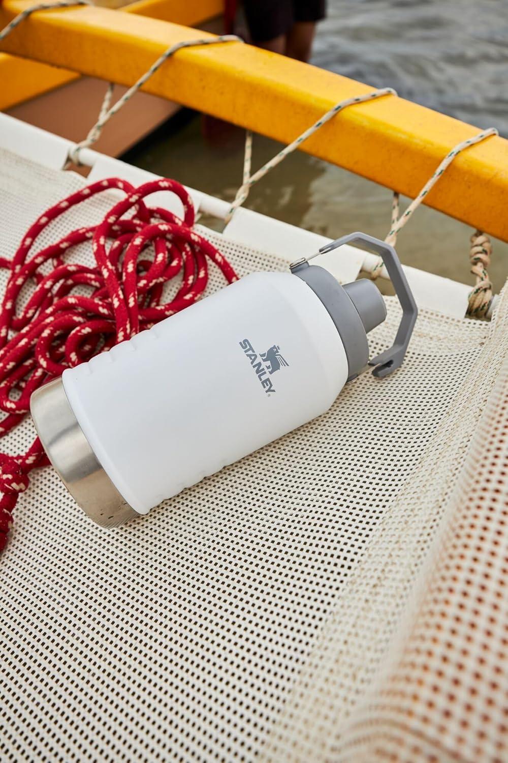 imageStanley IceFlow Fast Flow Jug with Handle 64 oz Twist On Angled Spout Lid Leakproof for Travel and Sports Insulated Stainless Steel BPAFree BlackPolar